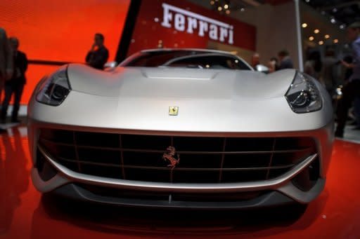 A new Ferrari F12 Berlinetta makes its world premiere at the Italian carmaker's booth at the Geneva Motor Show. Sports cars, reputed for being energy guzzlers, are now trying to boost their green credentials as they seek to attract environmentally conscious consumers and meet new climate standards