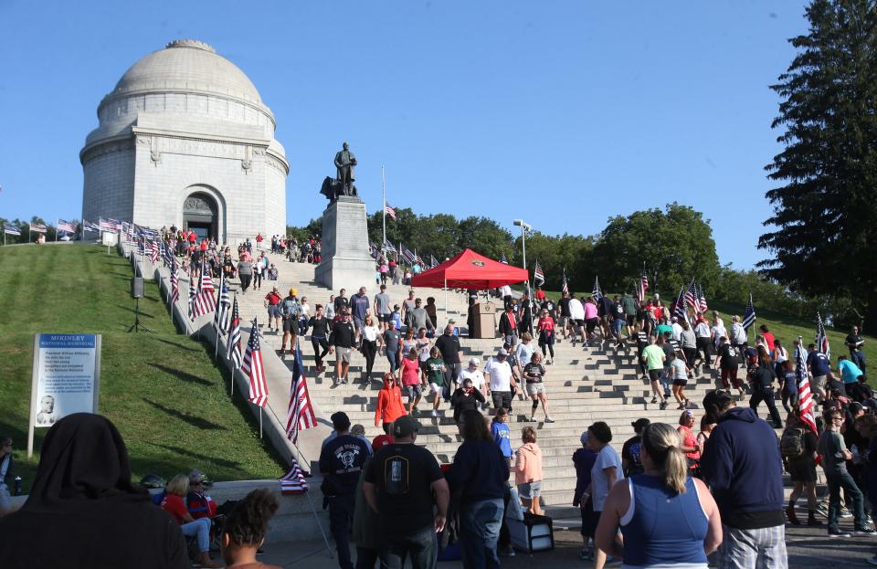 Participants of the Memorial Climb ascend the steps of the McKinley Presidential Library & Museum in Canton on Saturday. The event marked the 20th anniversary of the 9/11 attacks and recalled the memory of the 343 firefighters who lost their lives that day.