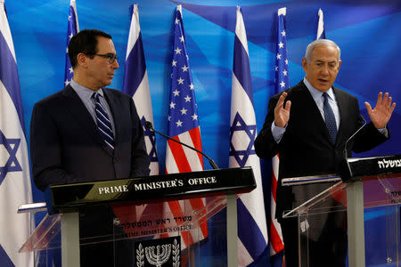 Israeli Prime Minister Benjamin Netanyahu gestures as he speaks to U.S. Treasury Secretary Steven Mnuchin prior to their meeting in Jerusalem October 21, 2018. Gali Tibbon/Pool via REUTERS