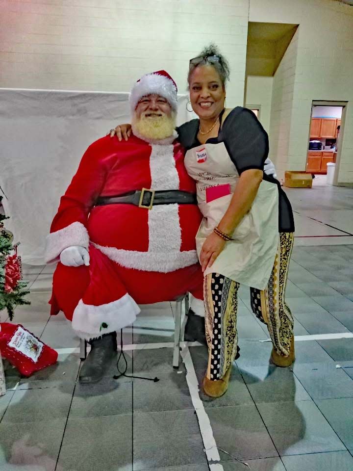 Santa and We Care About You (WCAY) founder Vanessa Lyons at the Christmas dinner Dec. 1.