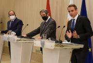 Cypriot President Nicos Anastasiades, Greek Prime Minister Kyriakos Mitsotakis and Egyptian President Abdel Fattah al-Sisi are seen during a news conference after a trilateral summit between Greece, Cyprus and Egypt, at the Presidential Palace in Nicosia