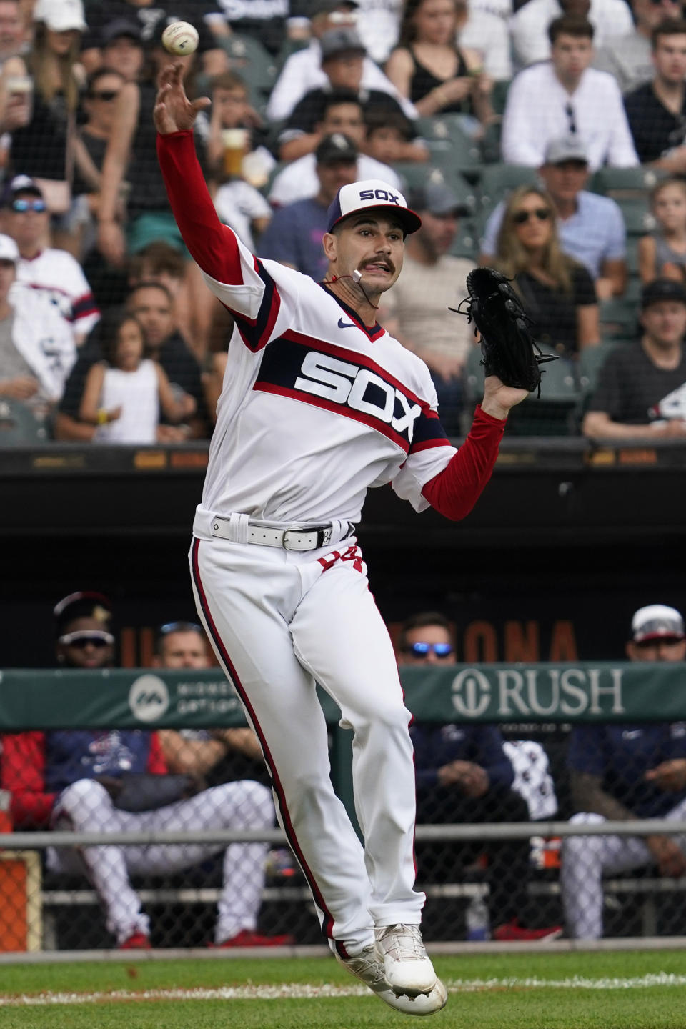 Chicago White Sox starting pitcher Dylan Cease throws to first base after Cleveland Guardians' Josh Naylor hit a single during the third inning of a baseball game in Chicago, Sunday, July 24, 2022. (AP Photo/Nam Y. Huh)
