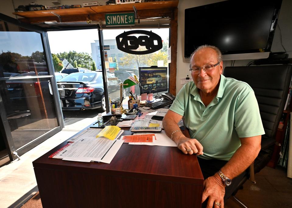 Tommie D. Simone inside New Worcester Motors on Shrewsbury Street.