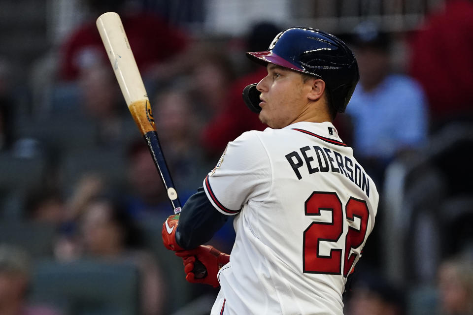 Atlanta Braves' Joc Pederson follows through on a two-run home run in the fourth inning of a baseball game against the Tampa Bay Rays, Saturday, July 17, 2021, in Atlanta. (AP Photo/John Bazemore)