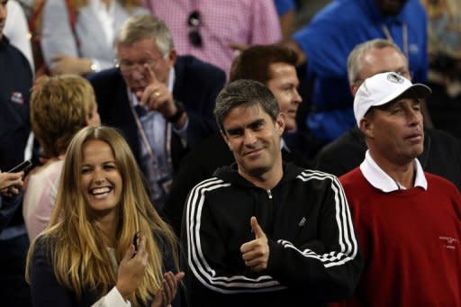 The faces of Andy Murray's girlfriend Kim Sears (left) and physiotherapist Andy Ireland (centre) break into smiles as he wins the US Open in New York on September 9 -- but the stoic countenance of coach Ivan Lendl (right) barely cracks despite his pupil's emotional victory. "That's almost a smile for him," Murray said as the crowd roared in delight