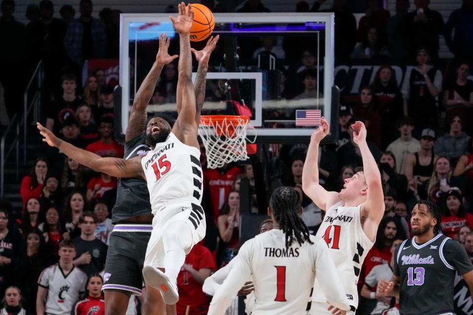 Cincinnati Bearcats forward John Newman III (15) breaks up a deep pass as time expires against Kansas State. UC got the hard-fought 74-72 win.