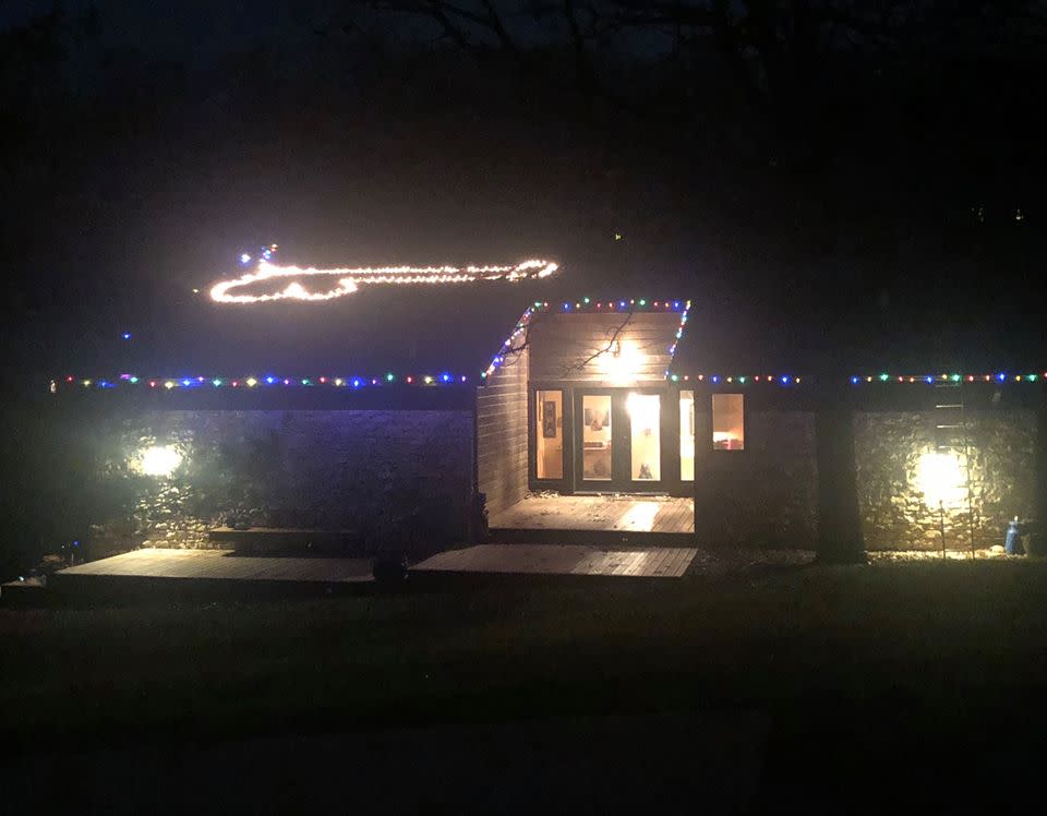 Kansas woman Shelby Gash shaped her Christmas lights into a penis on her roof (pictured).