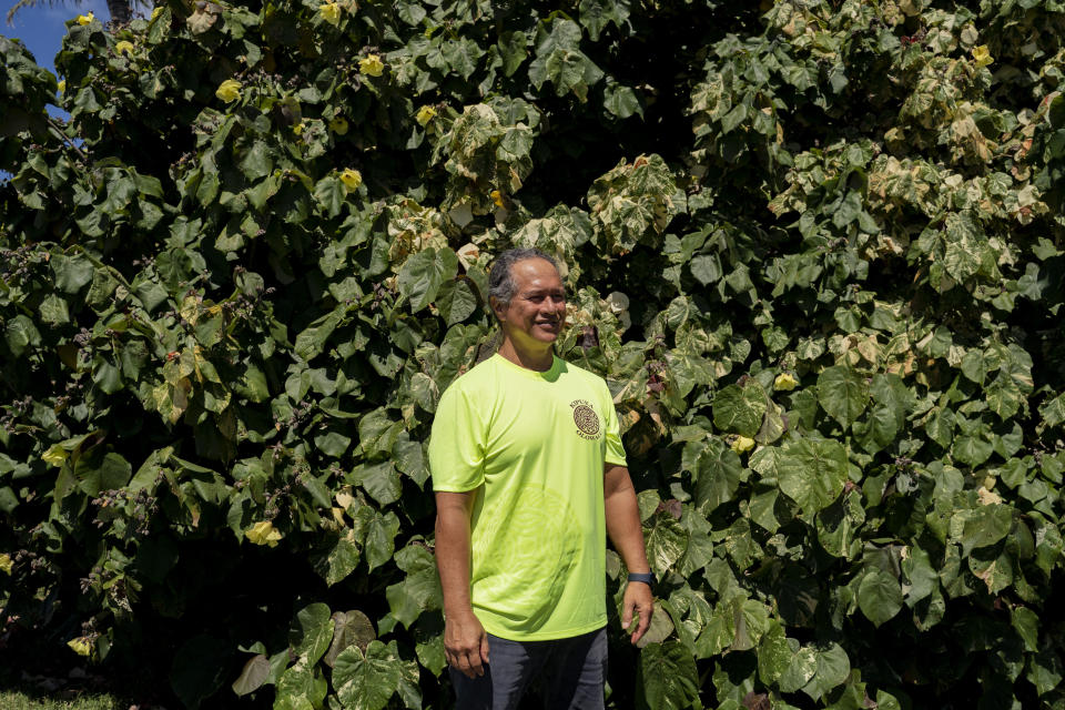 Ekolu Lindsey, a Lahaina community advocate who has long pushed to restore coral reefs, fishing and traditions in his hometown, poses for a portrait at Olowalu Landing on Friday, Feb. 23, 2024, in Lahaina, Hawaii. (AP Photo/Mengshin Lin)