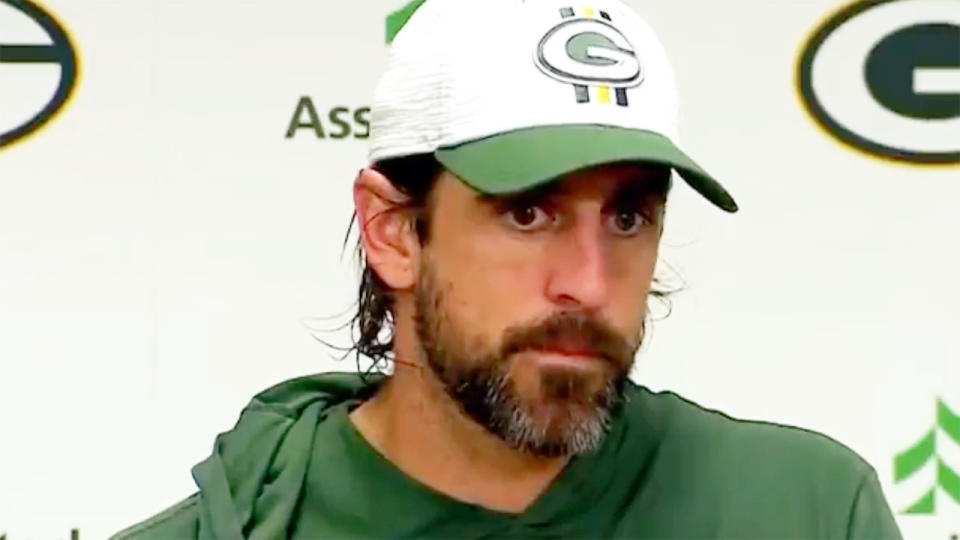 Pictured here, Green Bay QB Aaron Rodgers speaking at a press conference.