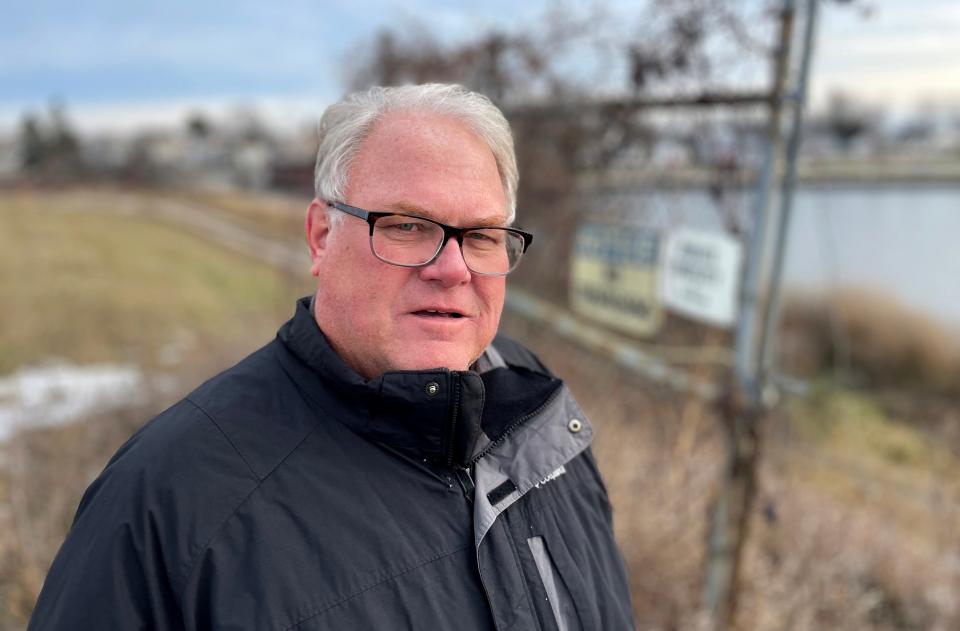 Greg Coenen, who was manager of the union local that represented many of the Thermo Fisher Scientific plant workers when it closed in 2011, stands near one of the few reminders of the demolished plant in Two Rivers.