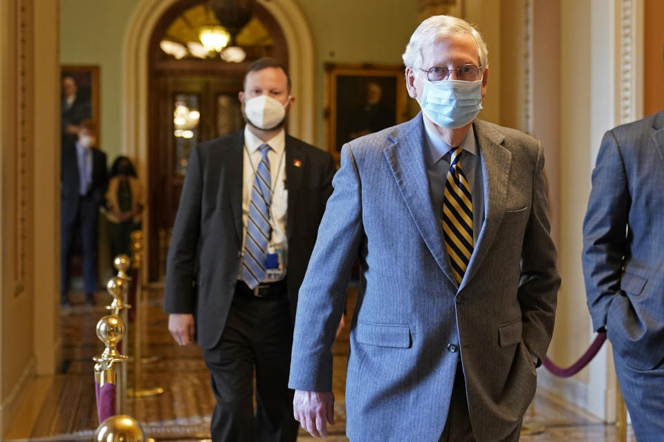 Senate Majority Leader Mitch McConnell of Ky., walks back to his office on Capitol Hill in Washington, Wednesday, Dec. 30, 2020. (AP Photo/Susan Walsh)