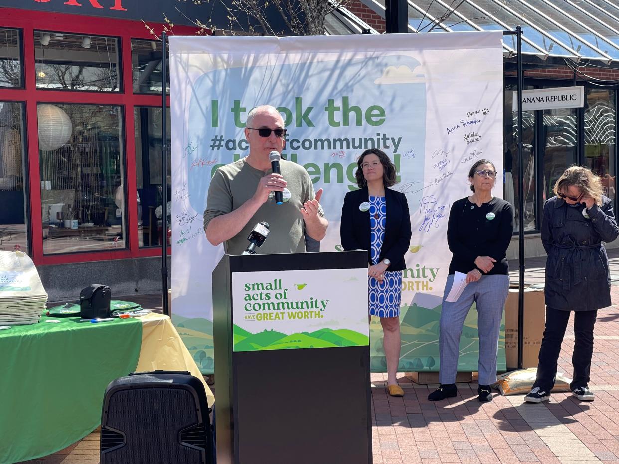 Mark Bouchett, owner of Homeport on Church Street, speaks at the Acts of Community press conference in front of his store, April 16.