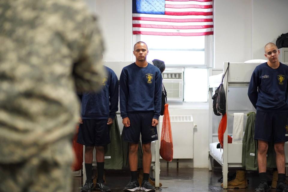 Cadet Kaleb Jones stands at attention with other cadets inside of the second platoon barracks at the Michigan Youth Challenge Academy in Battle Creek on Monday, June 10, 2024.