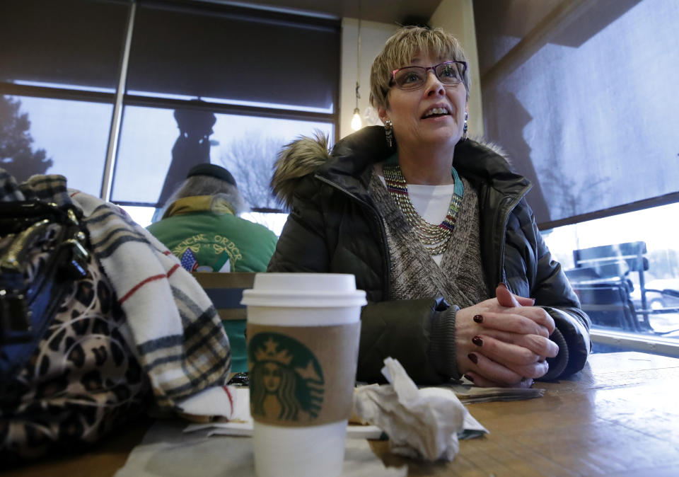 In this Tuesday, Jan. 29, 2019, photo Laurie Ware, a customer at Starbucks in Nashua, N.H., speaks about a potential presidential run by Starbucks founder Howard Schultz. Some people are already calling for a boycott of Starbucks, and the company itself emphasized that all customers, regardless of political affiliation, are welcome at its stores. (AP Photo/Elise Amendola)