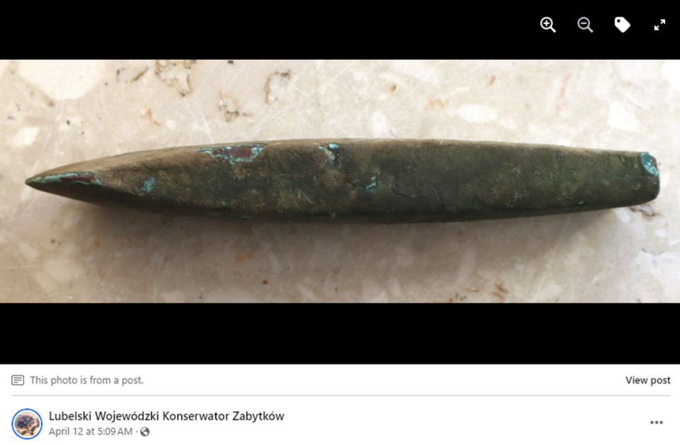 The ax may have been left as a gift to a deity, officials said. Screengrab from Lubelski Wojewódzki Konserwator Zabytków's Facebook post