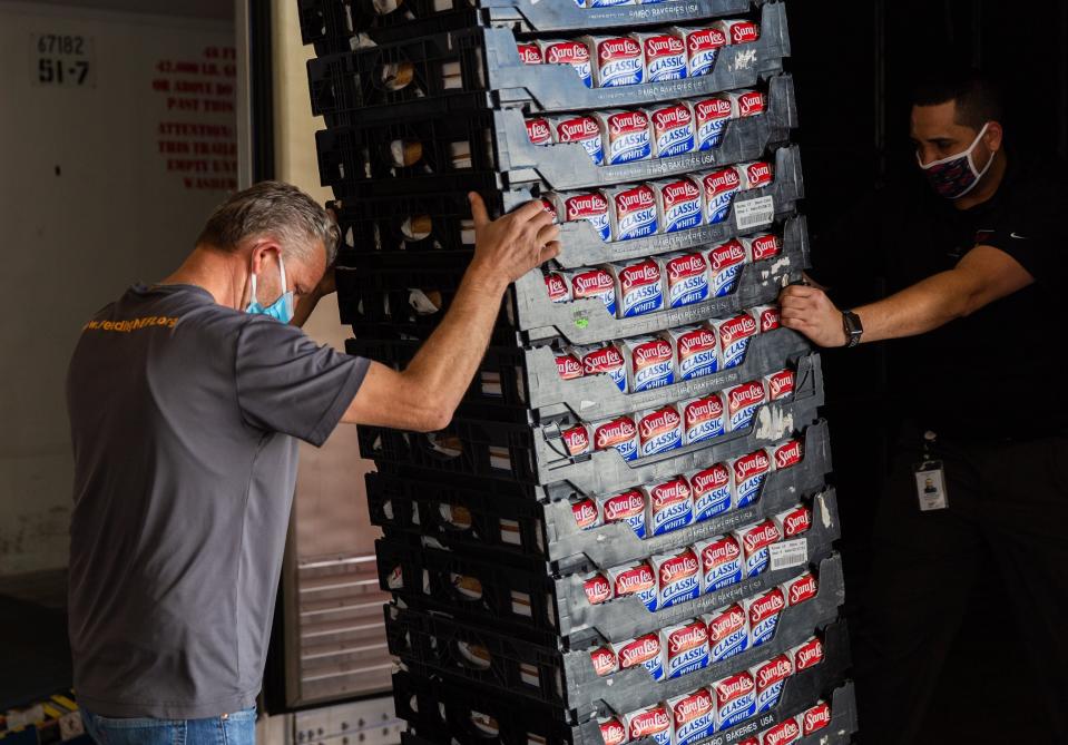 Containers of bread are delivered to Feeding Northeast Florida food bank in Jacksonville in 2021 as part of a food donation effort by Walmart, Bimbo Bakeries USA and Tyson Foods.