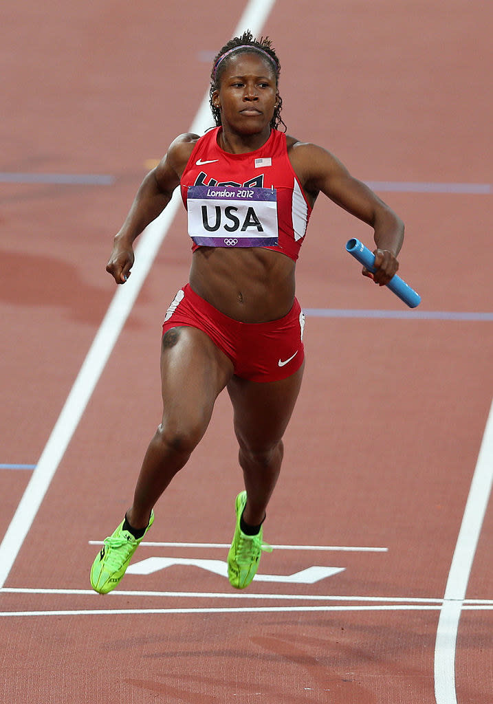 Williams runs the track with the baton in hand