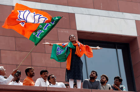 BJP supporters celebrate after learning the initial election results, in New Delhi, India, May 23, 2019. REUTERS/Adnan Abidi