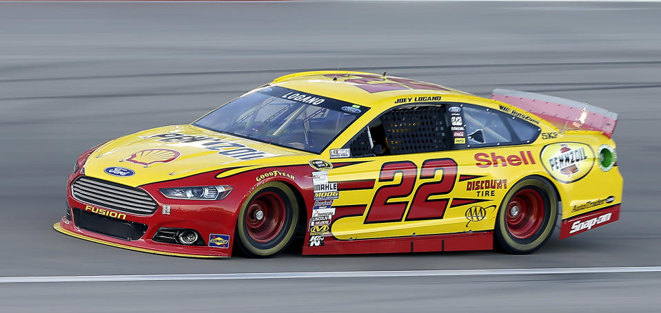 Joey Logano drives during qualifying for a NASCAR Sprint Cup Series auto race on Friday, March 7, 2014, in Las Vegas. Logano won the pole. (AP Photo/Isaac Brekken)