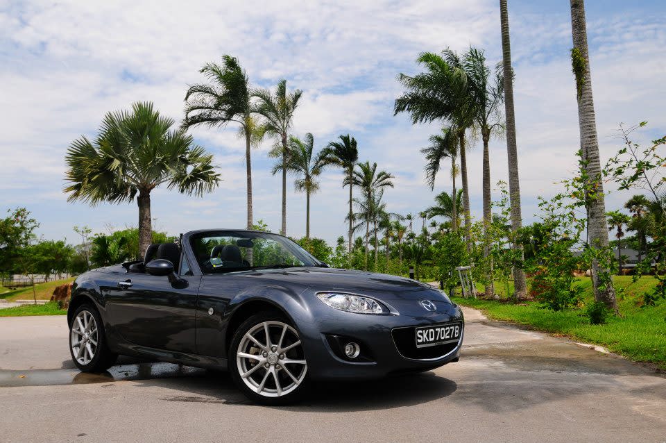 <b>Compact sporty car: <a href="http://autos.yahoo.com/mazda/mx-5-miata/2012/sport/" data-ylk="slk:Mazda MX-5 Miata;elm:context_link;itc:0;sec:content-canvas" class="link ">Mazda MX-5 Miata</a></b><br><br> Runners-up:<br> <a href="http://autos.yahoo.com/volkswagen/eos/2012/komfort/" data-ylk="slk:Volkswagen Eos;elm:context_link;itc:0;sec:content-canvas" class="link ">Volkswagen Eos</a><br> <a href="http://autos.yahoo.com/scion/tc/2012/sports-coupe-6-spd-at/" data-ylk="slk:Scion TC;elm:context_link;itc:0;sec:content-canvas" class="link ">Scion TC</a>