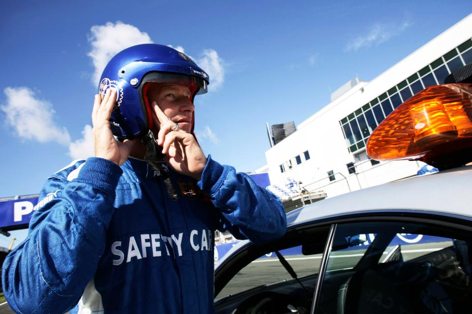 F1 safety driver Bernd Mayländer puts on his helmet at the 2007 European Grand Prix