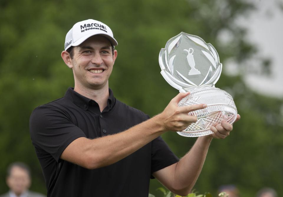Patrick Cantlay hoists the trophy for winning the Memorial Tournament at Muirfield Village Golf Club in Dublin, Ohio on Sunday, June 6, 2021. 