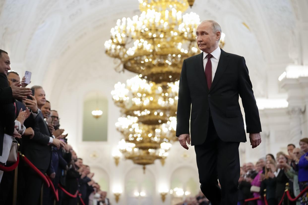 Vladimir Putin walks to take his oath as Russian president during an inauguration ceremony in the St. George Hall of the Grand Kremlin Palace in Moscow, Russia, Tuesday, May 7, 2024. Putin began his fifth term at a glittering Kremlin inauguration Tuesday, embarking on another six years as leader of Russia after destroying his political opponents, launching a devastating war in Ukraine and concentrating all power in his hands. (AP Photo/Alexander Zemlianichenko, Pool)