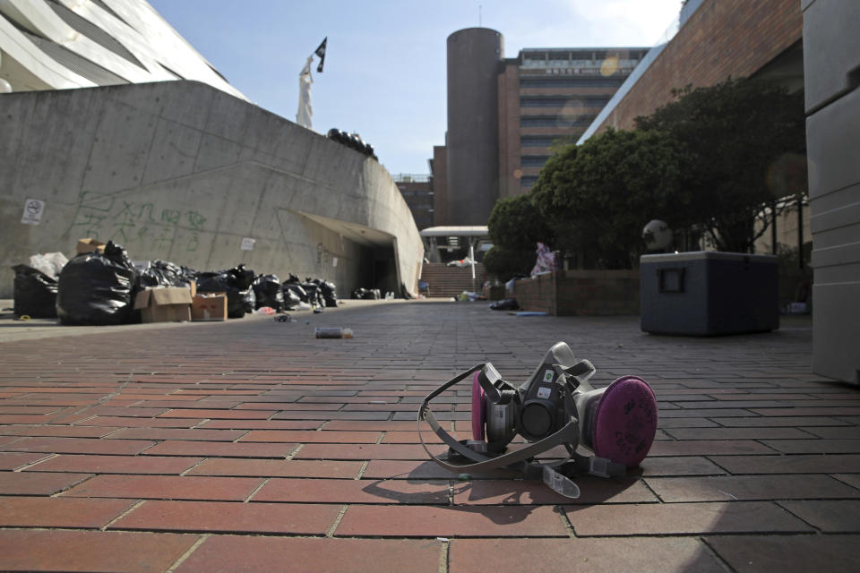 A teargas mask left by an anti-government protester is seen inside the Hong Kong Polytechnic University campus in Hong Kong, Friday, Nov. 22, 2019. Six masked protesters surrendered early Friday morning in Hong Kong, bringing to about 30 the number that have come out in the past day from the university campus surrounded by police. (AP Photo/Kin Cheung)