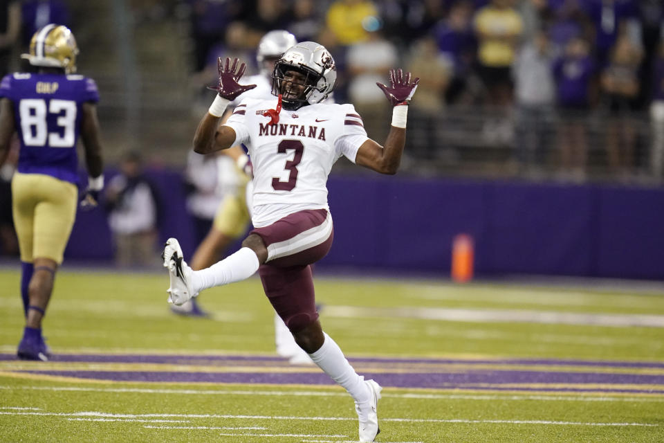 Montana's TraJon Cotton celebrates after the team stopped Washington on fourth down late in the second half of an NCAA college football game Saturday, Sept. 4, 2021, in Seattle. (AP Photo/Elaine Thompson)