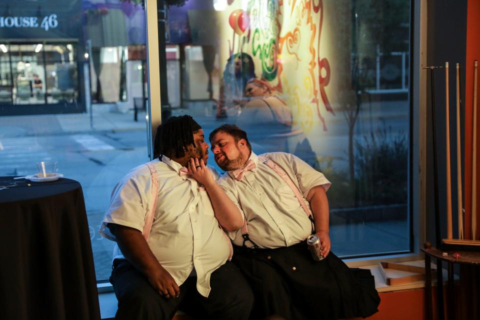 Deon Starks, 29, of Ypsilanti, and Liam Wolf, 34, of Ypsilanti share a kiss during the Prom ReDeux at Affirmations Detroit in Ferndale, Mich. on Saturday, June 24, 2023. Starks says Wolf is new to the area and wanted to show him Affirmations and introduce him to more of the Trans community. 