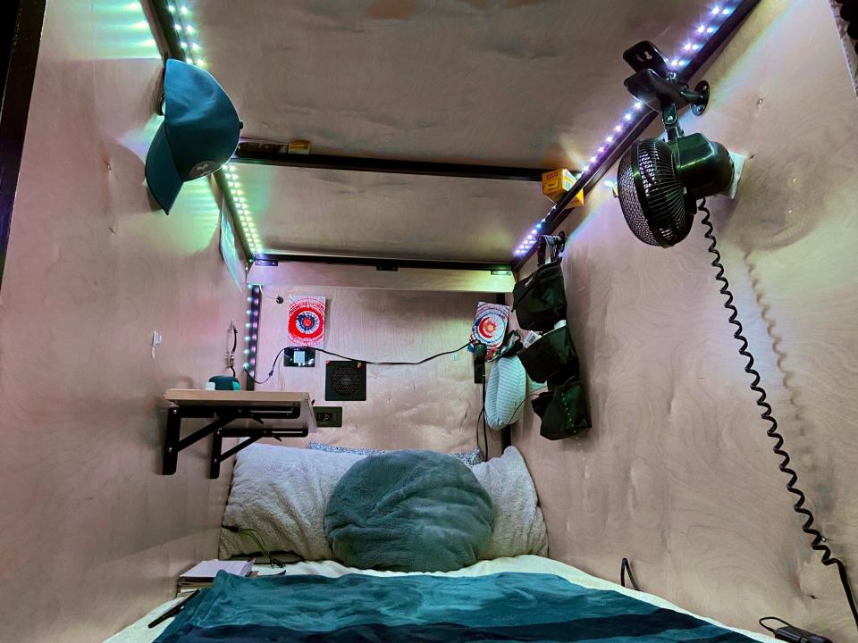 Inside a compact sleep pod in co-living house