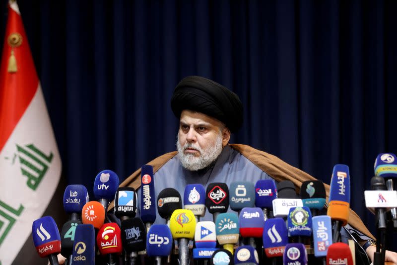 FILE PHOTO: Iraqi Shi'ite cleric Moqtada al-Sadr attends a news conference in Najaf