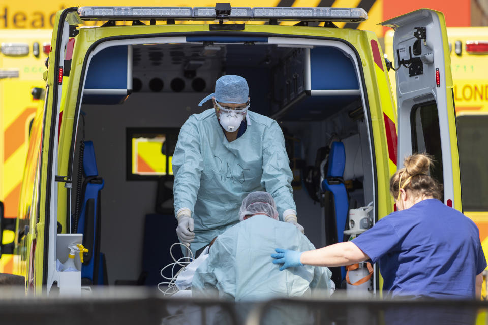 LONDON, UNITED KINGDOM - APRIL 10: NHS workers in PPE take a patient with an unknown condition from an ambulance at St Thomas' Hospital on April 10, 2020 in London, England. Public Easter events have been cancelled across the country, with the government urging the public to respect lockdown measures by celebrating the holiday in their homes. Over 1.5 million people across the world have been infected with the COVID-19 coronavirus, with over 7,000 fatalities recorded in the United Kingdom.   (Photo by Justin Setterfield/Getty Images)