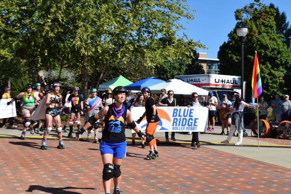 Members of the Blue Ridge Roller Derby skate along during the 2023 Blue Ridge Pride Precession Sept. 30.
