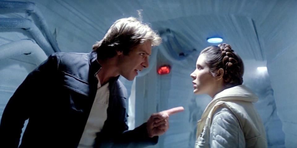 Harrison Ford as Han Solo and Carrie Fisher as Princess Leia