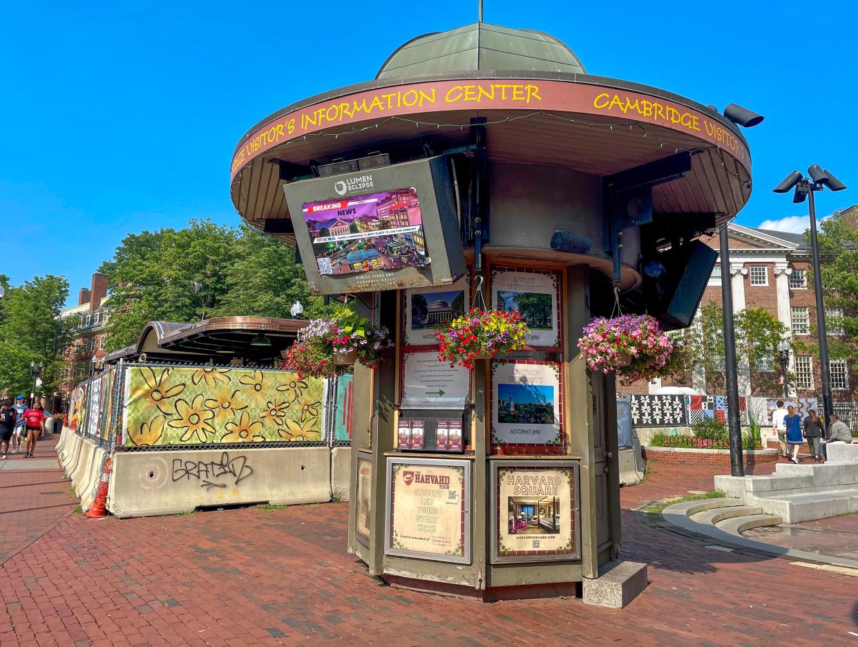 The beloved news and magazine kiosk, Out of Town News remains under wraps by the visitor information booth at the entrance to the Harvard Square T stop.