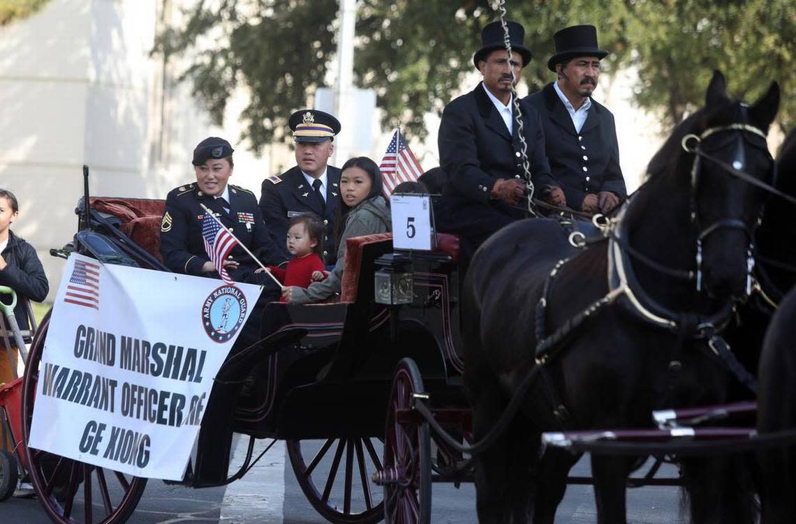 Fresno Veterans Day Parade grand marshall Warrant Officer One Ge Xiong and his family participate in the Veterans Day Parade on Nov. 11, 2022.