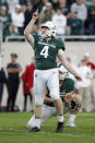 Michigan State kicker Matt Coghlin reacts as he watches his tie-breaking 21-yard field goal against Indiana with 5 seconds remaining during the fourth quarter of an NCAA college football game, Saturday, Sept. 28, 2019, in East Lansing, Mich. (AP Photo/Al Goldis)