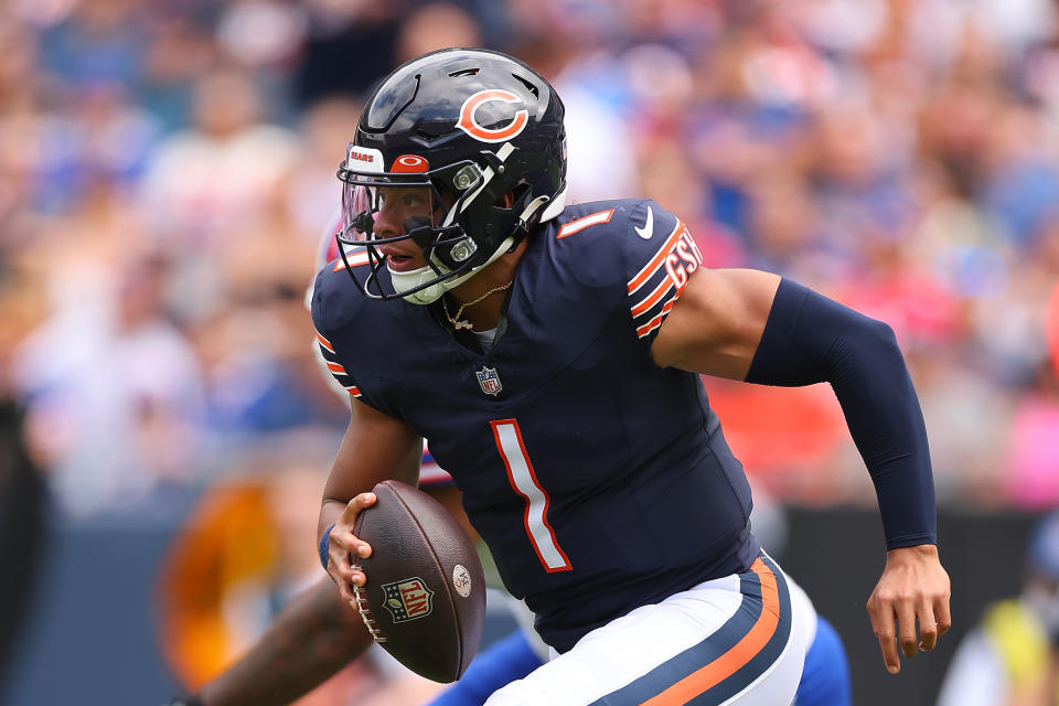 CHICAGO, ILLINOIS – AUGUST 26: Justin Fields #1 of the Chicago Bears runs with the ball against the <a class="link " href="https://sports.yahoo.com/nfl/teams/buffalo/" data-i13n="sec:content-canvas;subsec:anchor_text;elm:context_link" data-ylk="slk:Buffalo Bills;sec:content-canvas;subsec:anchor_text;elm:context_link;itc:0">Buffalo Bills</a> during the first half of a preseason game at Soldier Field on August 26, 2023 in Chicago, Illinois. (Photo by Michael Reaves/Getty Images) ORG XMIT: 775992239 ORIG FILE ID: 1640655433