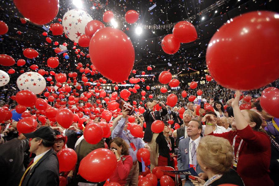 In this Sept. 4, 2008, photo, balloons fall on the floor as Republican presidential nominee John McCain is joined by his wife, Cindy, his family and his running mate, Sarah Palin, and her family, not pictured, on stage after his acceptance speech at the Republican National Convention in St. Paul, Minn. Viewer interest in the 2012 Republican and Democratic national conventions is still unclear. With the parties' quadrennial presidential nominating gatherings fast approaching, organizers on both sides are bedeviled by a similar challenge: how to ensure TV viewer interest in the multiday affairs, which threaten to be largely predictable spectacles nearly devoid of suspense. (AP Photo/Jae C. Hong)