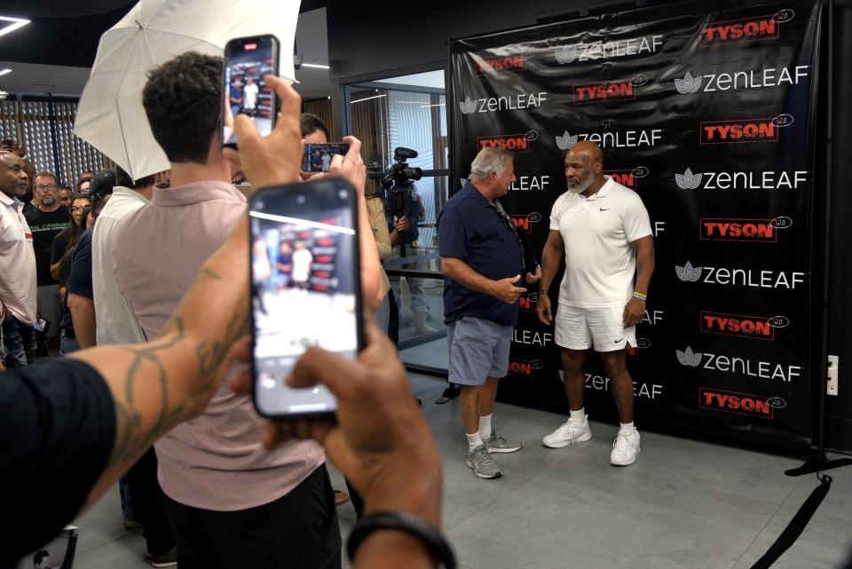 Neptune Township Mayor Nicholas Williams and Mike Tyson during a promotional tour of Tyson’s cannabis company Tyson 2.0 at Zen Leaf in Neptune Township, New Jersey on Saturday, September 3, 2022.