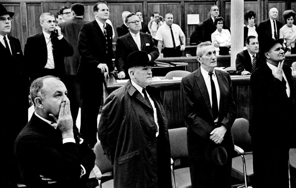 The faces of employees and clients on the floor of J.C. Bradford & Co. reflect their disbelief at the news that President John F. Kennedy has been shot on Nov. 22, 1963. The scene was repeated in many business firms and offices throughout Nashville and Tennessee, as commercial and social activities came to a halt.