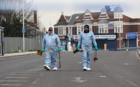 Police near the scene in Seven Kings, Ilford - Credit: PA