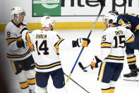 Nashville Predators center Kyle Turris (8) and defenseman Mattias Ekholm (14), of Sweden, celebrate after Craig Smith (15) scored the go-ahead goal against the Buffalo Sabres during the third period of an NHL hockey game Saturday, Jan. 18, 2020, in Nashville, Tenn. The Predators won 2-1. (AP Photo/Mark Zaleski)