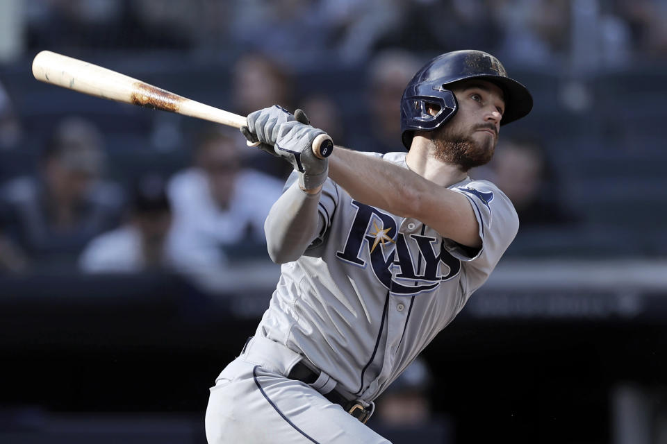 Tampa Bay Rays' Brandon Lowe hits a home run during the seventh inning of a baseball game against the New York Yankees on Saturday, Oct. 2, 2021, in New York. (AP Photo/Adam Hunger)
