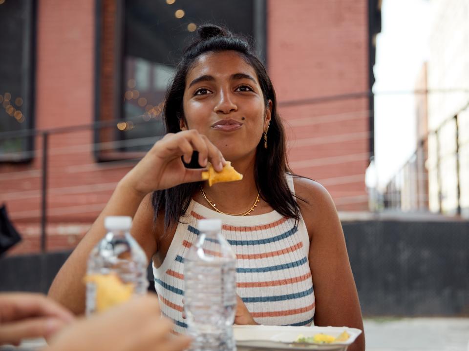 A young woman eating.