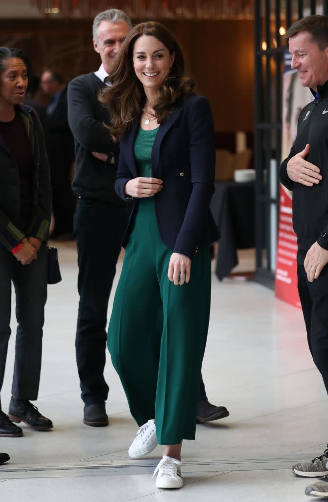 The Duchess of Cambridge sports white trainers at charity event. (Getty Images)