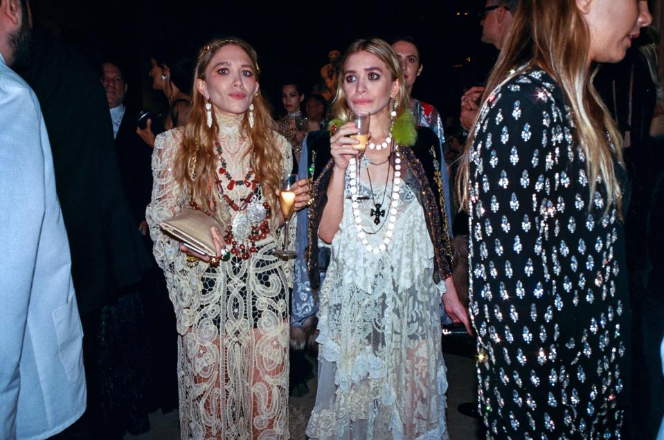 Mary-Kate Olsen and sister Ashley make their way through the 2017 Met gala.