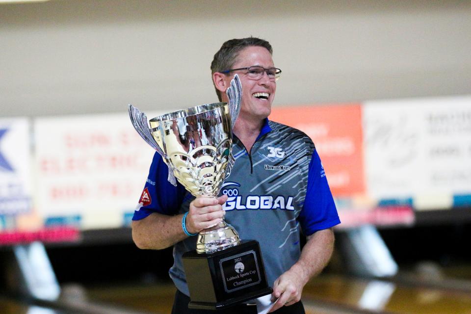 Hall of Fame bowler Chris Barnes cradles the trophy after winning the PBA50 Cup in 2021 at South Plains Lanes in Lubbock. The win was the first on the PBA50 for Barnes. He has won 19 times on the PBA Tour, on which he is still a full-time player.