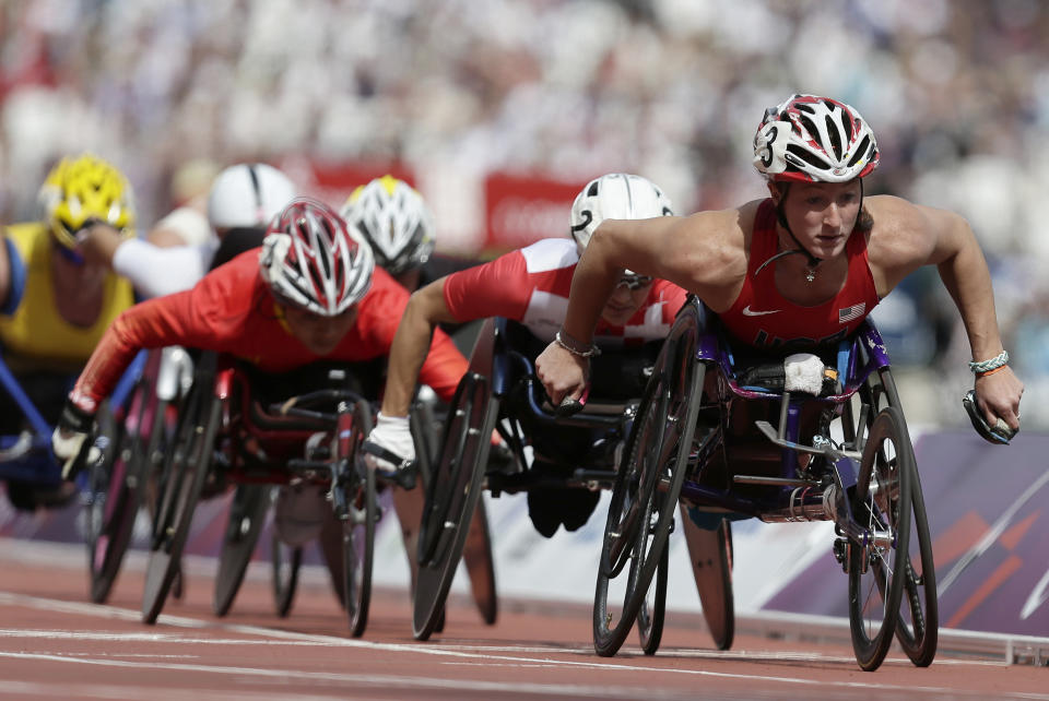 Tatyana McFadden of the United Sates, right looks as she competes in a women's 1500-meter T54 category heat at the 2012 Paralympics games, Thursday, Sept. 6, 2012, in London. (AP Photo/Alastair Grant)